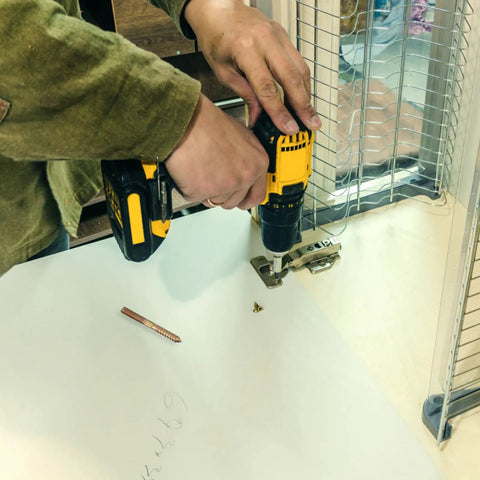 Person using drill with Double Headed Hanger Bolts Self Tapping Screws For Furniture And Wood Joints, Carbon Steel, Corrosion Resistant Golden Hardware Fasteners