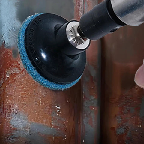 Close-up of a right-angle pneumatic die grinder with a blue 2-inch roll-lock sanding disc attached.
