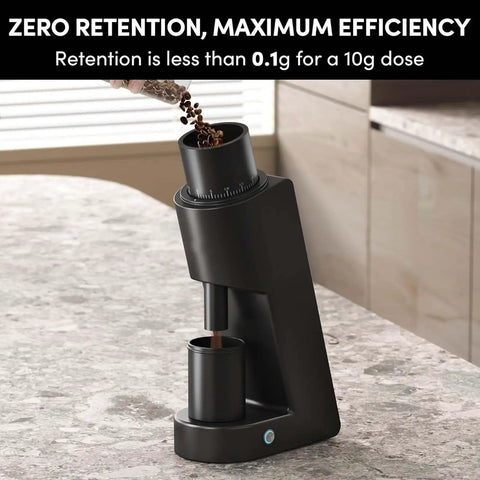 Top Shelf Single Dose Electric Coffee Grinder With 38mm Conical Burrs And Stepless Dial 30G Hopper pouring beans for espresso.