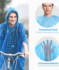 Person wearing blue Disposable Emergency Rain Ponchos For Adults And Kids, Family Pack Of 12 In 4 Colors, with drawstring hood.