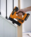 Using 20V Cordless Pro Grade 2 In 1 18 Gauge Nailer And Stapler Kit With One And A Quarter Inch Nails And Staples on stairs