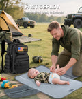 Active dad using Military Style Diaper Backpack With Large Changing Pad And Insulated Compartments For Active Dads On The Go With Dad Gear For Hiking Travel Camping Army Inspired Tan at campsite