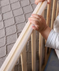 Child holding clear silicone edge protectors for tables and furniture, baby proofing corner guards with pre taped adhesive