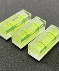 Three sleek acrylic six pack mini magnetic bubble levels with neon vials for precise measurements.