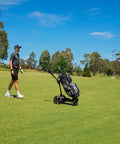 Pro Level Electric Golf Cart With Smart Remote Control And All Terrain Grip For Smooth Walking Assistance and Go The Distance Rounds on green fairway.
