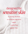 Text on skincare cream texture reading 'designed for sensitive skin, no drying alcohols, no artificial fragrance, vegan, cruelty free, gluten free'.
