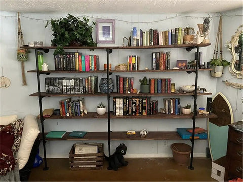 Industrial Style Pipe Shelf Brackets Set Dope Three Pcs Five Tier Wall And Ceiling Shelves Hardware Only For DIY Open Bookshelves Rustic Farmhouse Look 70 Inches Tall 12 Inches Deep with books and decor.