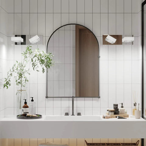 Lit Three Light Chrome Vanity Light Bar With Dimmable LED Heads over bathroom mirror, modern chrome finish.