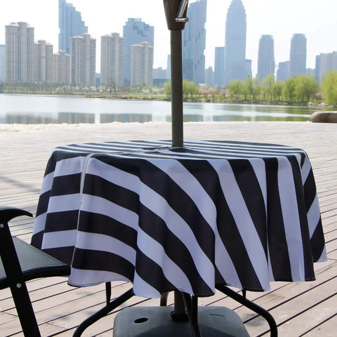 Outdoor Round Tablecloth 60 Inch With Zipper Umbrella Hole Water Resistant Polyester Durable Patio Garden Table Cover For BBQs And Parties Easy To Clean Shrink Resistant Black on patio table with cityscape background