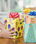 25 Party Favor Bags For Kids Birthday Parties With Star Pattern In 5 Colors next to gift boxes