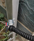 Heavy Duty Flexible Metal Conduit Corrugated Electrical Hose With Pvc Coated Wire Protection Tube One Hundred Meter Roll connected to metal fitting.