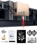 Installed xTool S1 1064nm laser module on a desktop engraver; copper head; seven sample items shown below.