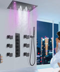 Sleek Matte Black Ceiling Rain Shower System With 24X32 Inch Led Spray Head, showcasing water flow and adjustable jets.