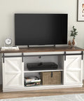 65 Inch TV Stand With Storage Cabinets And Sliding Barn Doors In Bright White Dope Farmhouse Style Entertainment Console With Mid Century Modern Flair For Living Room Or Bedroom Holds Flat Screen TV And Keeps Cables Tidy, featuring wooden shelves and decorative items