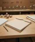 Heavy Duty Desktop Wood Carving Jig With Killer Grip And Precision Stop on a woodworking table with tools nearby.