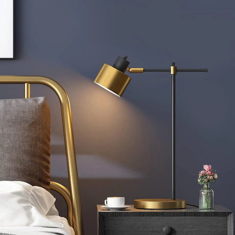Mid Century Modern Desk Lamp with Matte Black Finish and Gold Accent on bedside table, 22.25 inch tall, in bedroom setting.