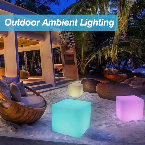 16-Inch Cordless LED Cube Light With Removable Panels illuminating outdoor patio at night, creating vibrant ambiance.