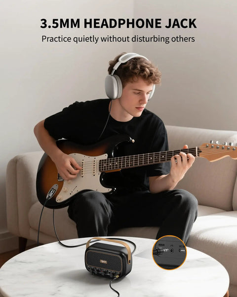 Person using Compact 5W Per Channel Guitar Amp, Portable Battery Powered Practice Speaker With Bluetooth for headphone practice