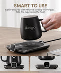 Level Up Your Morning Vibe This Smart Mug Warmer Game Changer Keeps Your Daily Brew Piping Hot With Precision Temp Control 15 Oz Ceramic Mugs Lids And Spoons Simple Cord Setup with black ceramic mug and heating base.