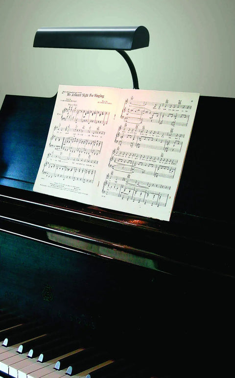Piano with sheet music illuminated by Led T10 120V 5W Frosted Dimmable Glass Bulb 2 Pack For Piano Light And Banker Light.