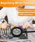 Technician using 2 In 1 Magnifying Desk Lamp With Light And Timer For Craft And Sewing on circuit board with magnifying glass.
