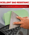 Application of Ready Mix Epoxy Fairing Compound One Gallon Heavy Duty Formula on a vertical surface with a spatula.