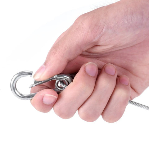 Hand holding Beefy Heavy Duty 31.5 Inch Stainless Steel Stage Light Safety Cable, clip detail for easy security.