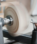 Rugged As A Nail Heavy Duty Steel Wood Lathe Faceplate Three Inches Diameter mounted on a lathe for wood shaping.