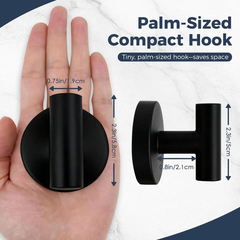 Heavy Duty Suction Hooks That Hold Firm On Glass Tile And Mirror Removable Shower Hangers With Rock Solid Vacuum Grip Easy Mount Metal Bathroom Towel Rack Four Pack Black shown palm-sized compact hook next to hand for scale.