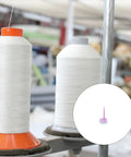 Desk Yarn Stand With Swivel Wheels And Textured Non Slip Base holding spools for weaving and knitting projects, close-up view