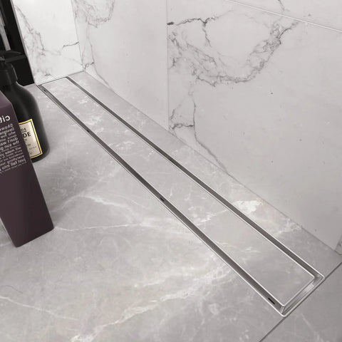 24 Inch Linear Shower Drain With Tile Insert Grate And Hair Strainer in brushed 304 stainless finish, mounted in tiled floor