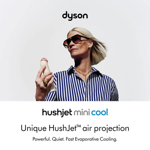 Person holding HushJet Mini Personal Fan With Quiet Evaporative Cooling in hand, showcasing portable design and airflow.