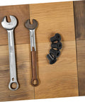 Heavy Duty Carbon Steel Barn Door Track Clamps Set 4 Pcs Spacers near wrenches on wood surface