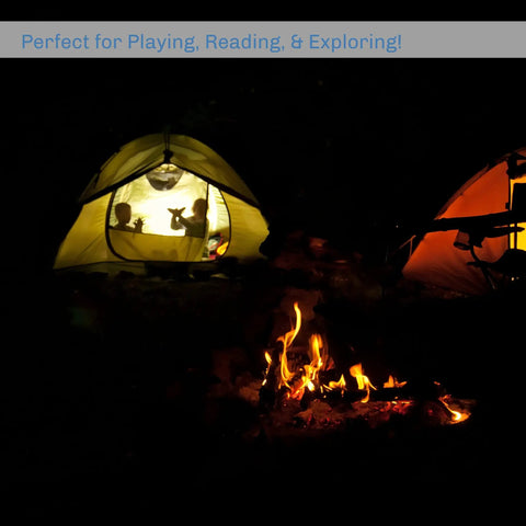 Campfire scene with a glowing tent, showcasing Three In One LED Lantern For Camping And Emergencies Ultra Compact And Lightweight Light.