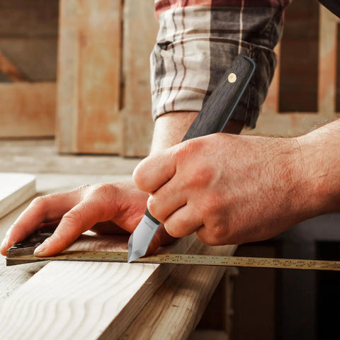 Badass Woodworking Marking Knife Built Tough With A Razor Sharp Double Bevel Blade And Slick Leather Sheath For Precise Layout Marks in use on wood.