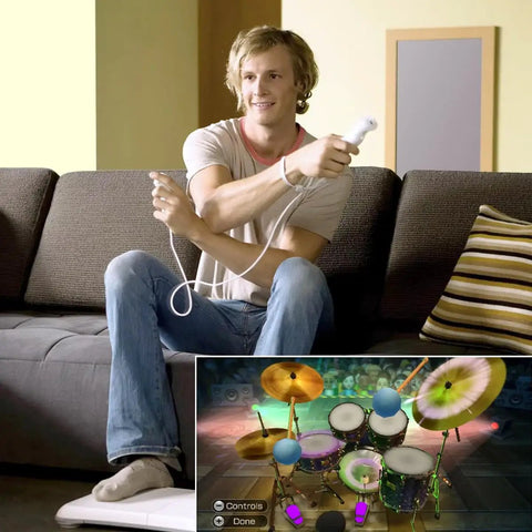 Man playing game with Remote Controller With Nunchuck For Nintendo Wii And Wii U Two Pack White Dope Motion Controls, drum game displayed