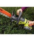 A person trimming a hedge with a 22 Inch Cordless Hedge Trimmer With 18 Volt Power Delivers Beast Mode Performance In A Lightweight Easy