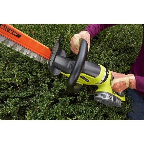 A person trimming a hedge with a 22 Inch Cordless Hedge Trimmer With 18 Volt Power Delivers Beast Mode Performance In A Lightweight Easy