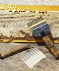 8 Head Beekeeping Scraper Pen for Hive Cleaning, durable plastic tool with jelly extractor, shown on honeycomb frame