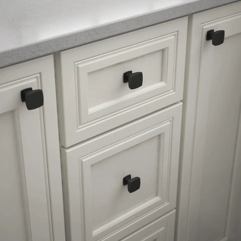 Square Matte Black Cabinet Knobs 10 Pack for Dresser Drawers Kitchen Cabinets Doors Vanity Furniture and Closet Easy Install Durable Metal Hardware Perfect for Upgrading Cabinets with Casual Modern Look installed on white cabinetry.