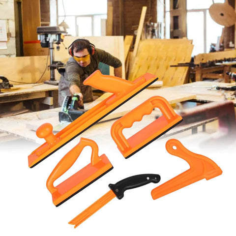 Five Piece Push Block And Push Stick Set For Woodworking Safety displayed in front of a workshop scene