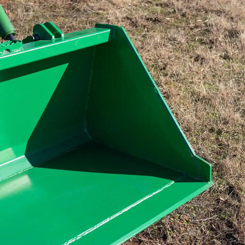 Close-up of green 5 Foot Dirt Bucket Attachment For Tractors That Fits John Deere Hook And Pin Tractors on grassy field