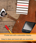 Pocket Digital Scale 100g x 0.01g High Precision Gram Scale with LCD Display, placed on a wooden surface with accessories.