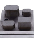 Versatile Alloy Steel Punch Die Disc Set for Jewelry Crafting and Metal Beading, showing four rectangular punch dies on steel block.