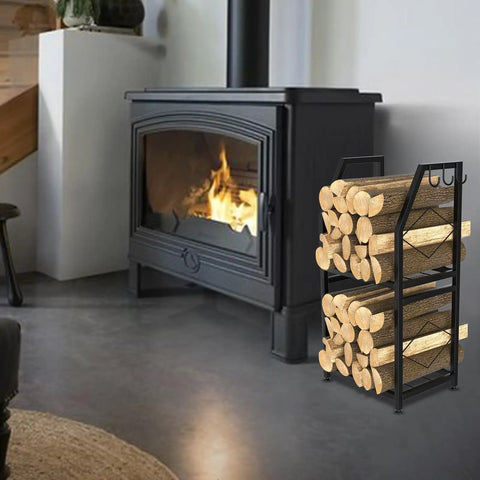 Two Tier Firewood Rack With 3 Hanging Hooks Heavy Duty Steel Wood Holder next to a lit indoor fireplace