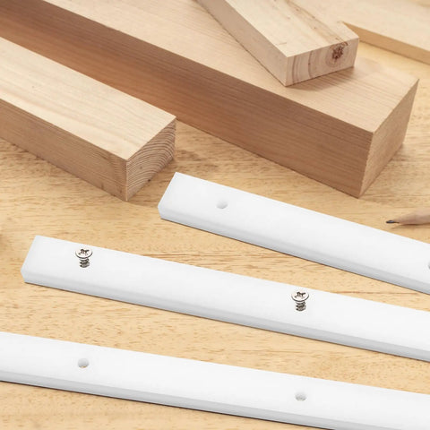 Four Piece Crosscut Sled Kit For Table Saw With Predrilled Holes, UHMW sliders on wooden surface, showing screws and miter bars.