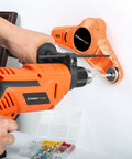 Side view of orange EnerTwist cordless drill with bit in chuck drilling into wall; carrying case with bits visible.