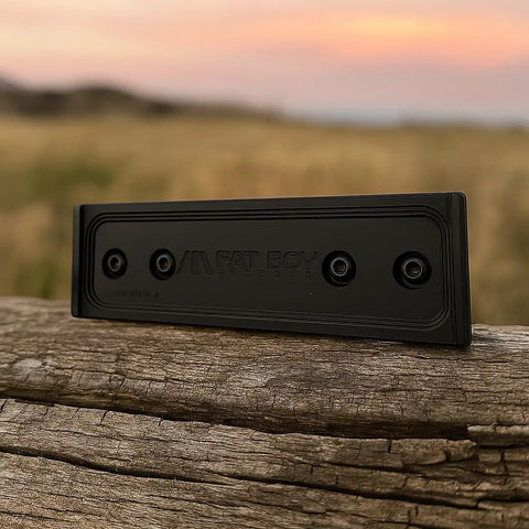 M-LOK ARCA Rail Plate Mount for tripods on wooden surface at sunset, durable field accessory for shooting and photography