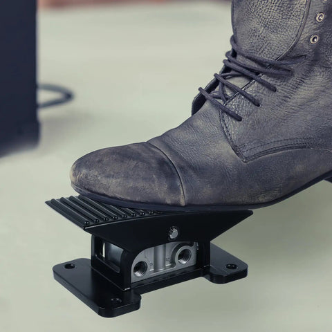 Five Way Three Position Center Closed Pneumatic Foot Pedal Valve with Leak Proof Zinc Alloy Body, black rocker style, in use