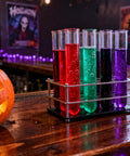 Halloween Test Tube Drink Set 24 Pack With Rack And Lids in spooky bar setting with colorful liquid-filled tubes in rack.